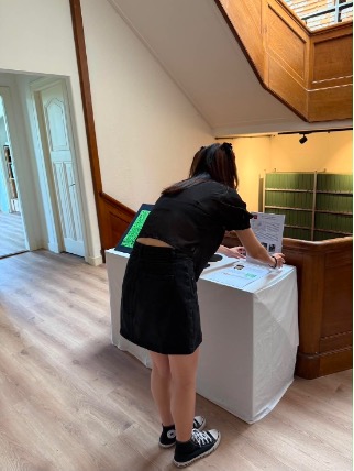 Fig. 6. Installing exhibition texts and making the final adjustments before the exhibition opening. Photograph by author.