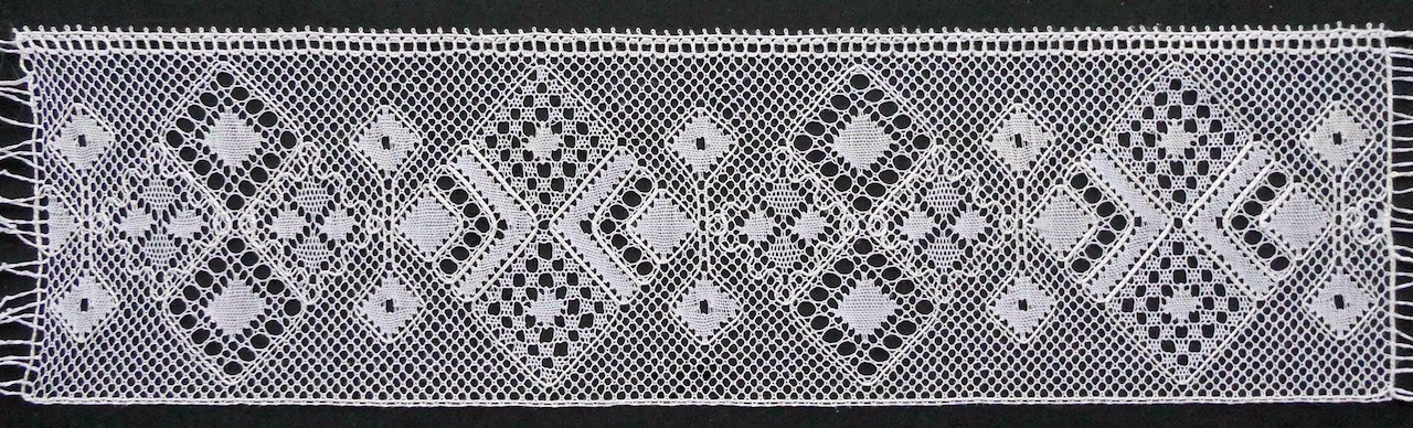 The pattern newly worked, showing the true beauty of the bobbin lace.