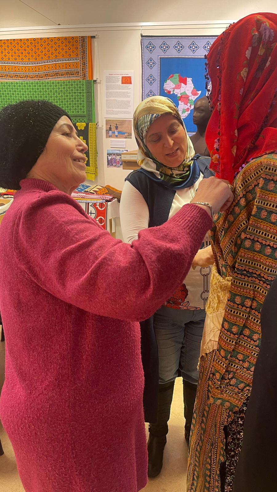 A group of women with a Turkish background discussing Turkish garments. Photograph by Maria Linkogle.
